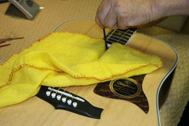 Internal truss rod adjustment on guitars.